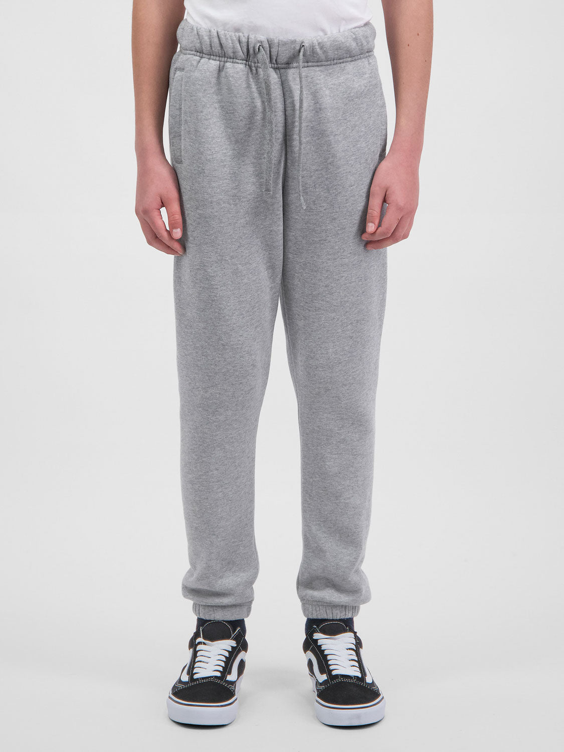 Youth Basis Track Pant in grey marle with an elastic drawstring waist and cuffed ankles.