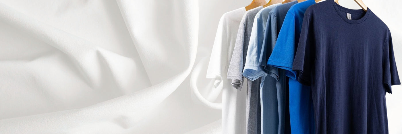 Row of t-shirts on a hanger against a white background