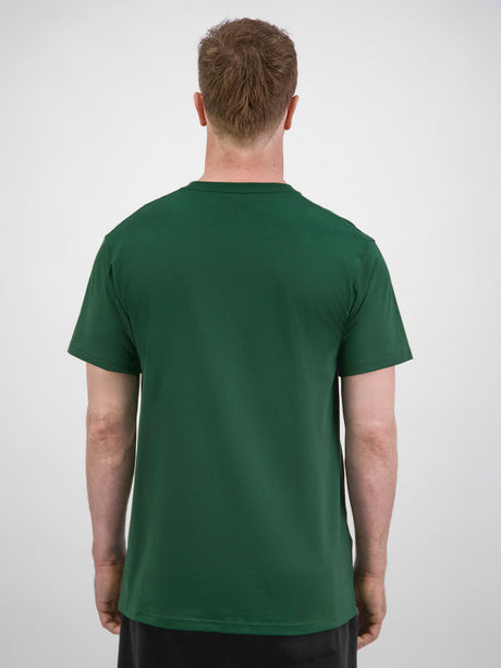 Rear view of a man wearing a dark green short sleeve cotton t-shirt with a ribbed crew neck.