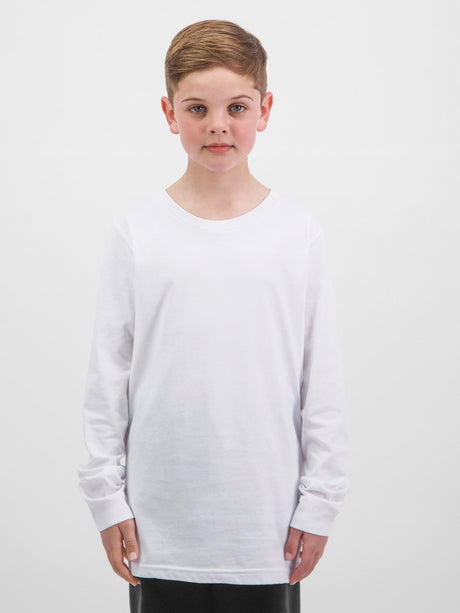 A young boy wearing a white, long-sleeve crew neck cotton t-shirt against a plain white background.