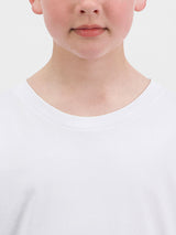 Close-up of a child wearing a white long-sleeve cotton tee with a ribbed crew neckline.