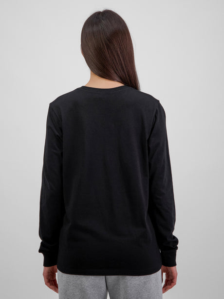 Rear view of a woman wearing a black long sleeve cotton t-shirt with ribbed cuffs.