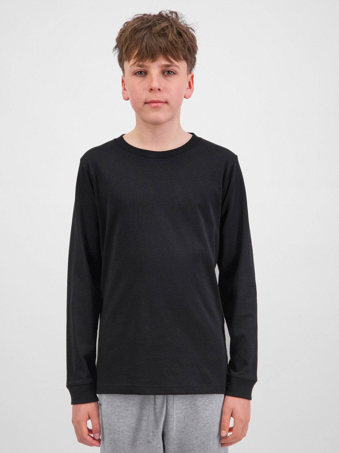 Youth Basis Long Sleeve Tee in black with a ribbed crew neck and classic fit.