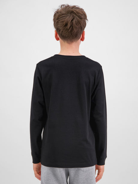Rear view of a youth wearing a black long sleeve cotton t-shirt and grey shorts.