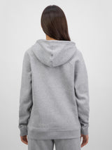 Rear view of a woman wearing a grey marle Basis Hoodie with a relaxed fit and ribbed hem.