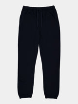 Mens Basis Track Pant in navy blue with an elastic drawstring waist and cuffed ankles.