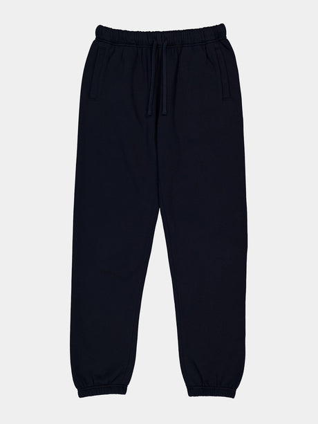 Womens navy blue relaxed fit track pants with an elastic drawstring waist and cuffed ankles.
