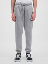 Youth Basis Track Pant in grey marle with an elastic drawstring waist and cuffed ankles.