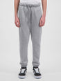 Youth Basis Track Pant in grey marle with an elastic drawstring waist and cuffed ankles.