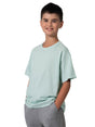 Ramo - A young boy wearing a light mint green regular fit cotton t-shirt and grey joggers.